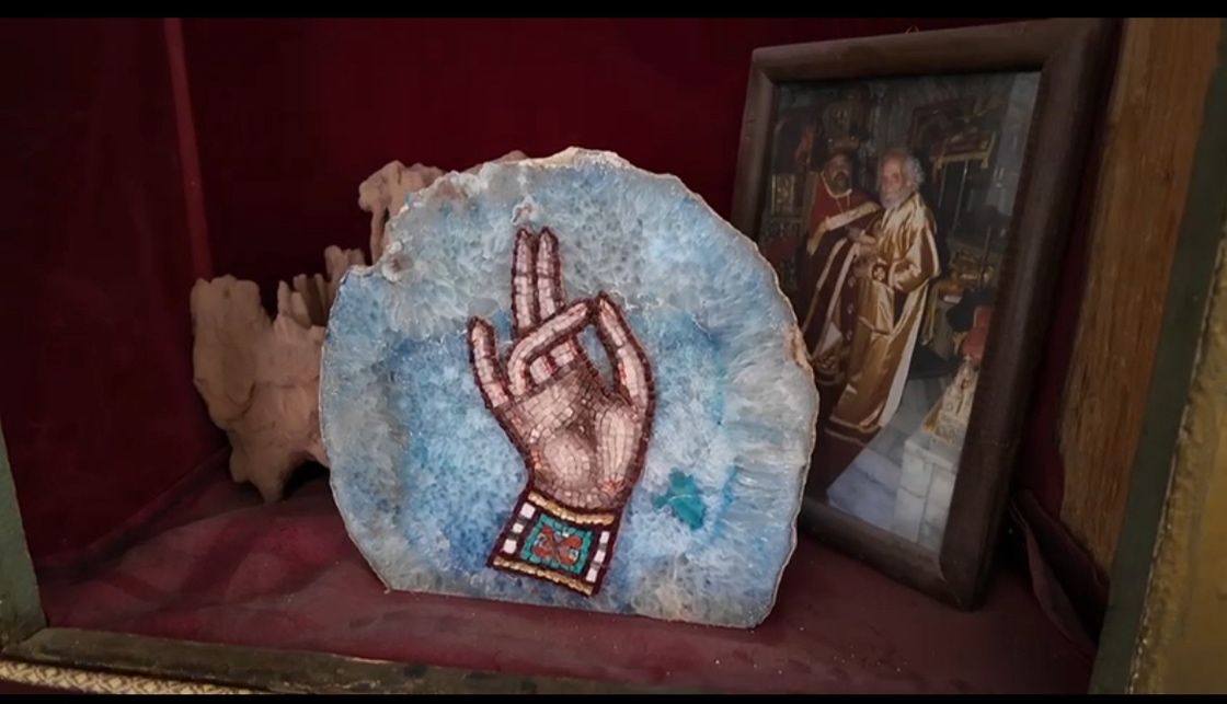 A piece of blue rock with a hand drawn sign

AI-generated content may be incorrect.